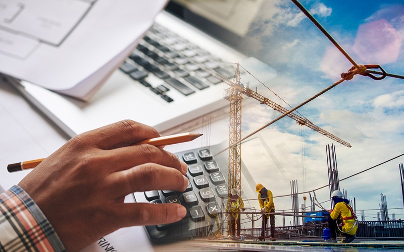 AUS Construction workers with blueprints